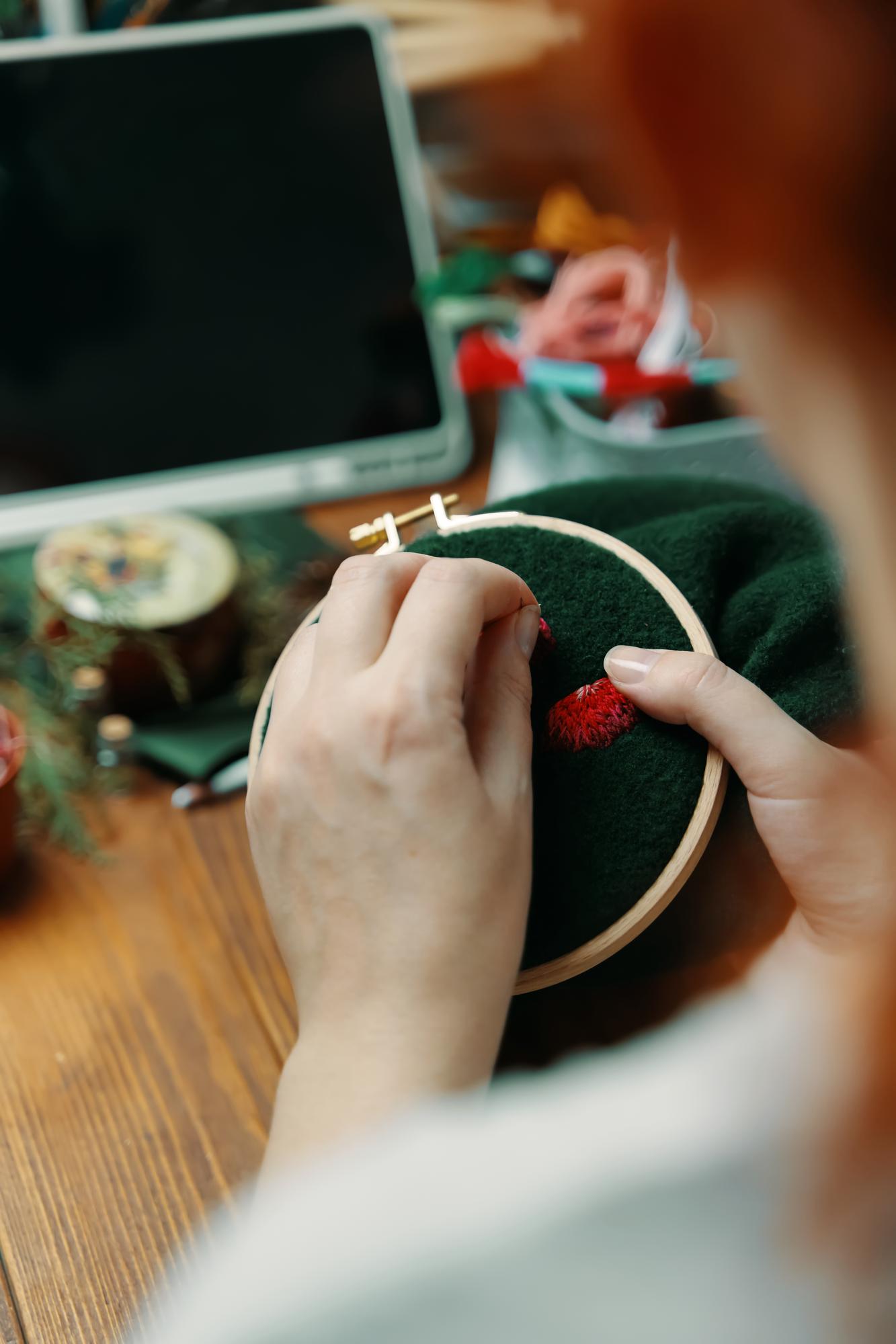 artisan embroiderer at work in studio